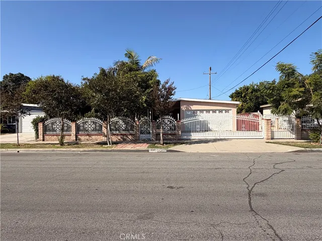 a view of a house with a street