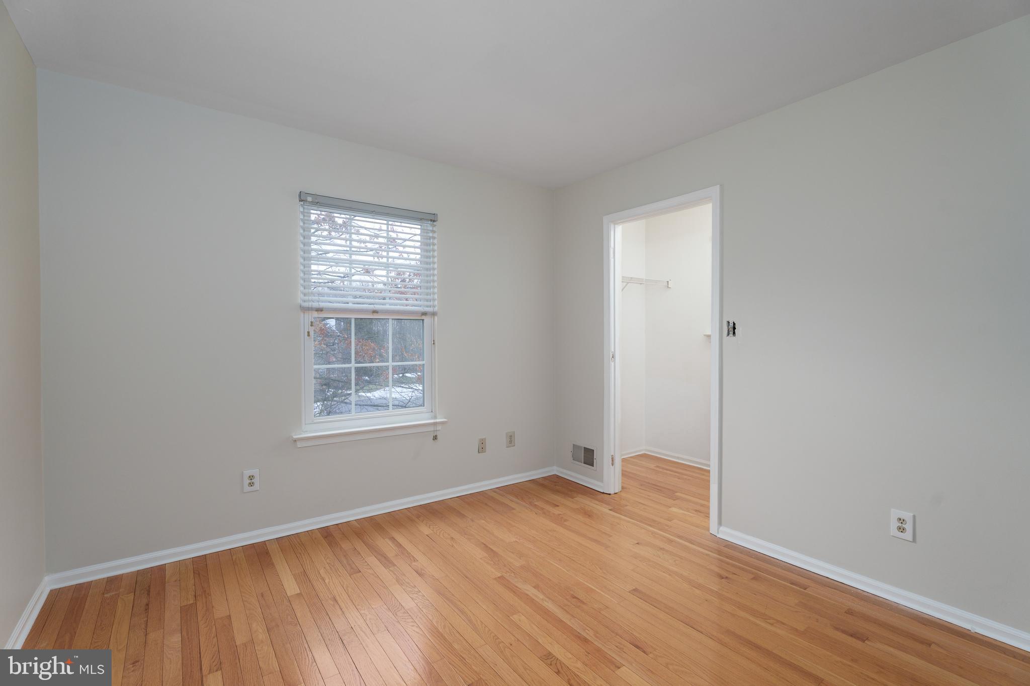 19 Rider Terrace Princeton, NJ 08540 - Photo 21 of 28 a view of an empty room with wooden floor and a window