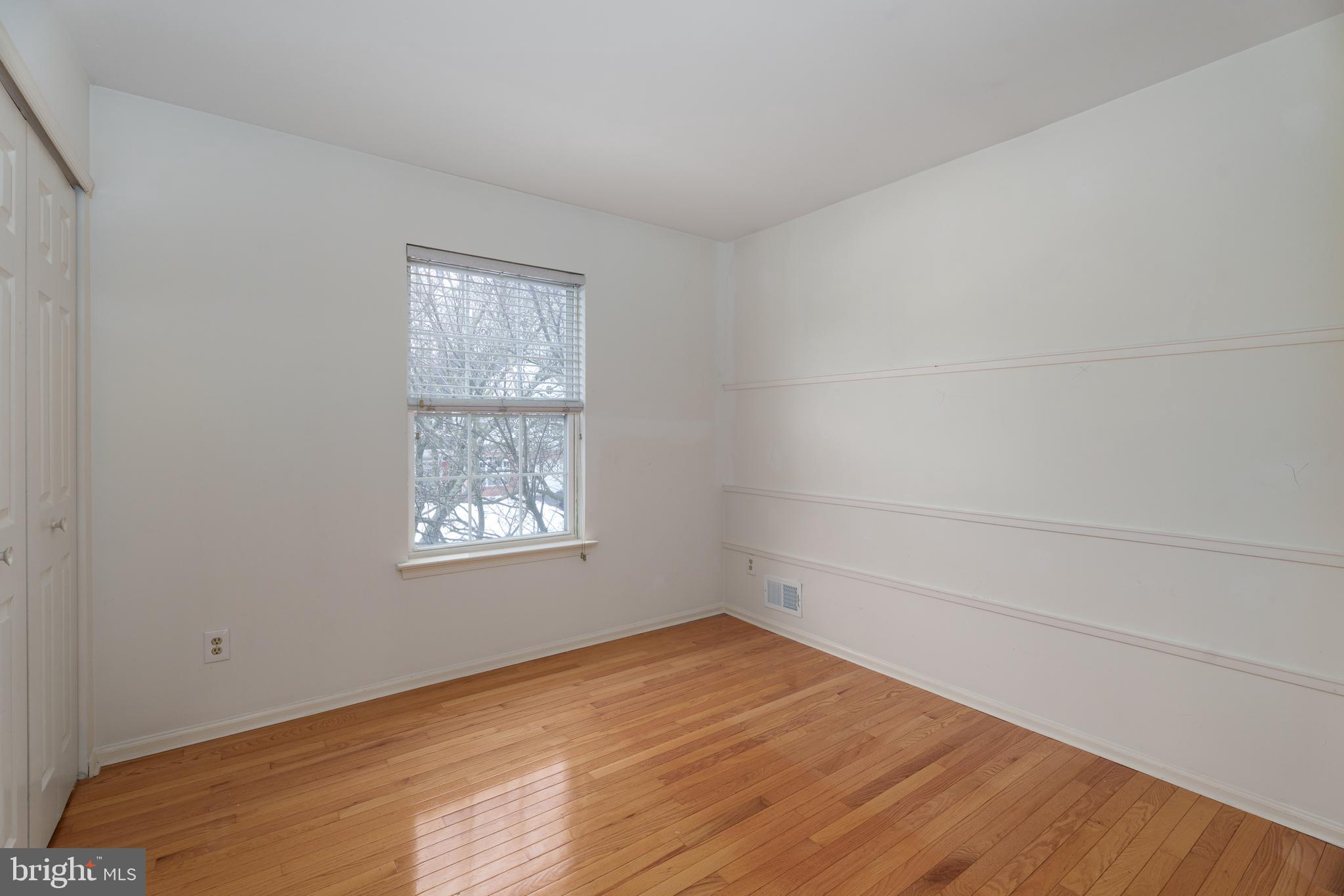 19 Rider Terrace Princeton, NJ 08540 - Photo 22 of 28 wooden floor in an empty room with a window