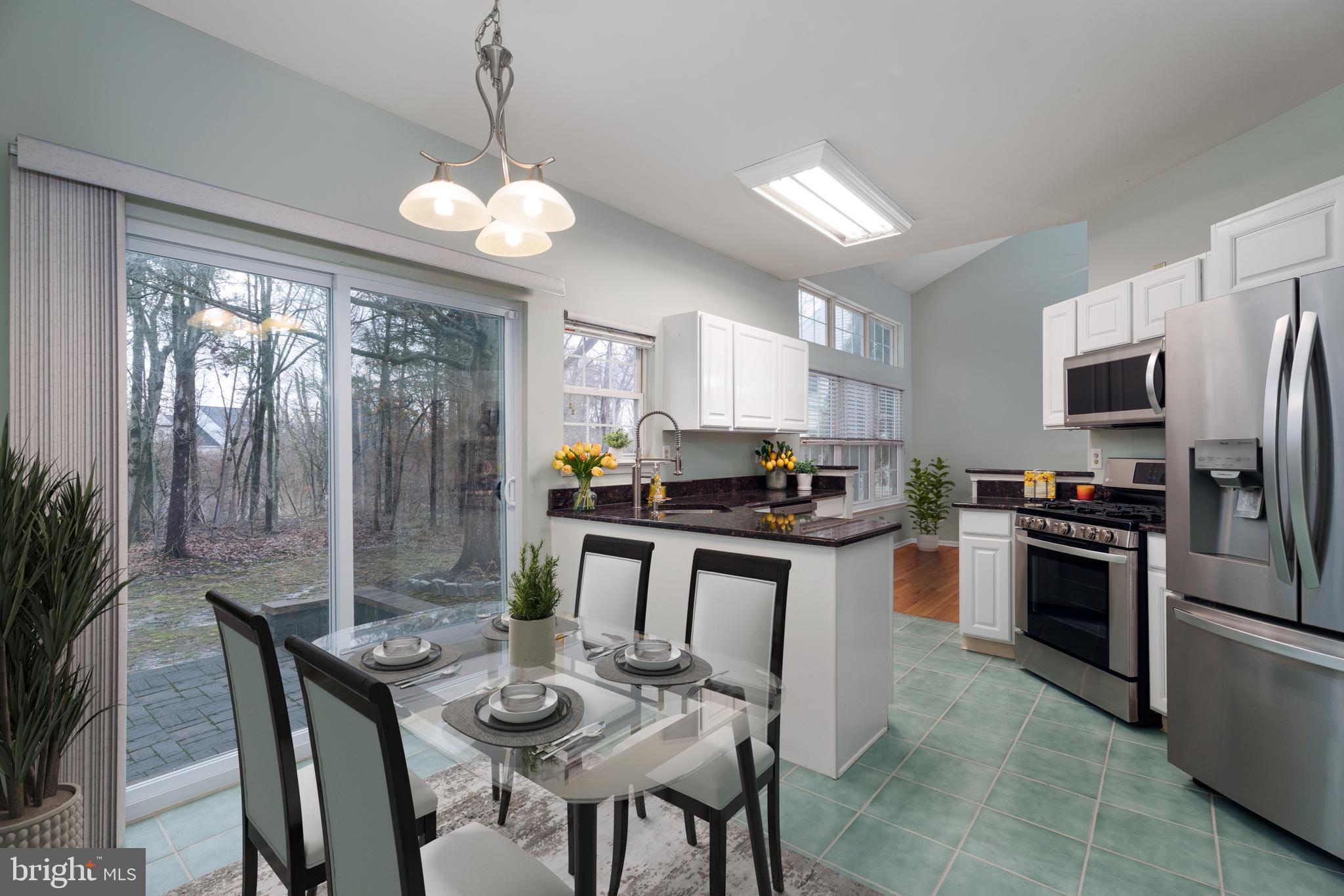 19 Rider Terrace Princeton, NJ 08540 - Photo 8 of 28 a kitchen with refrigerator a stove and chairs