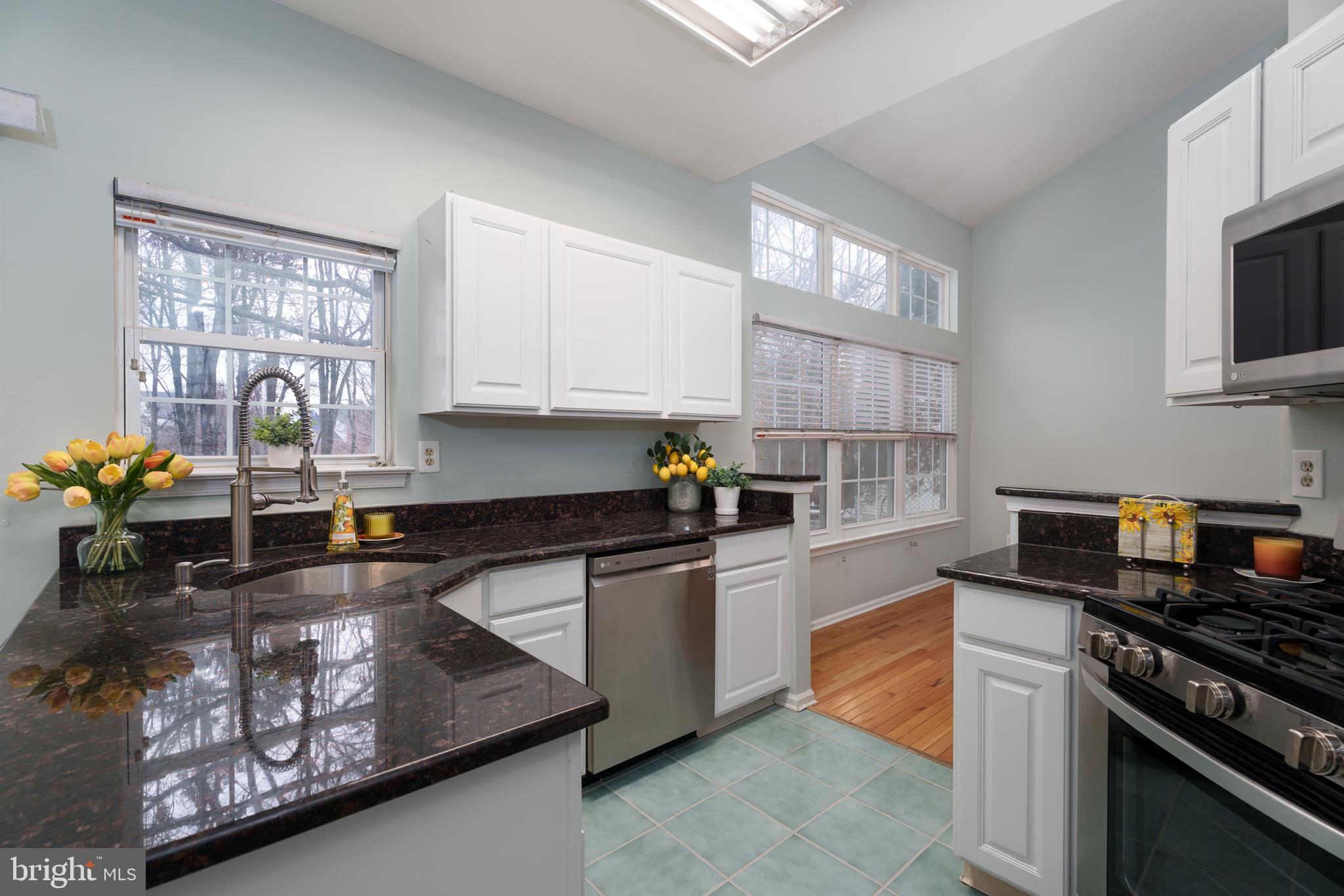 19 Rider Terrace Princeton, NJ 08540 - Photo 9 of 28 a kitchen with stainless steel appliances granite countertop a stove sink and cabinets