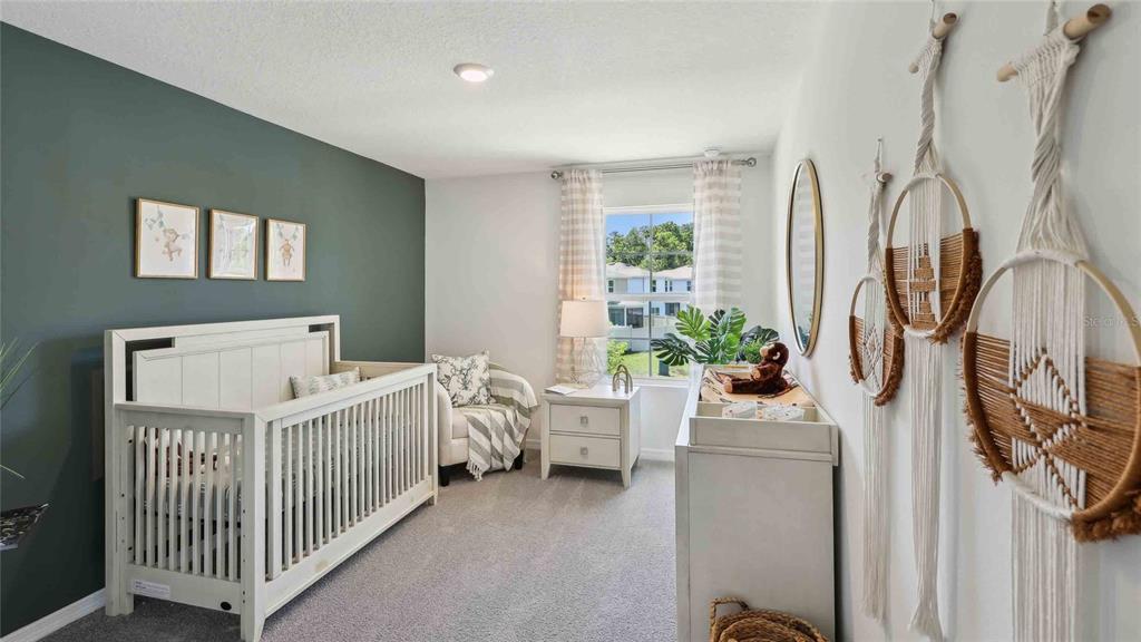 24430 Northwest 10th Road Newberry, FL 32669 - Photo 20 of 24 a bedroom with a bed and a window