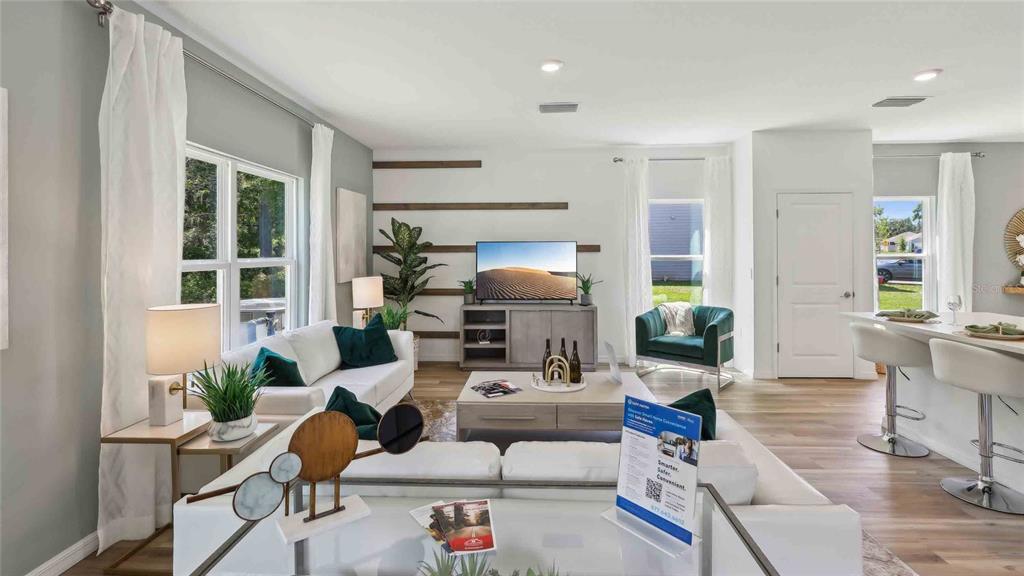 24430 Northwest 10th Road Newberry, FL 32669 - Photo 8 of 24 a living room with furniture and a potted plant