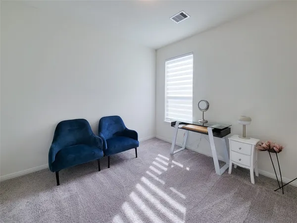 a view of a room with wooden floor and cabinet