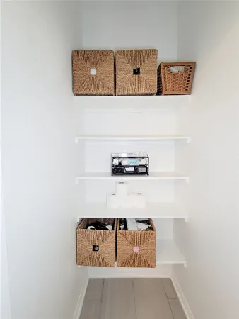 a bathroom with a tub sink vanity and mirror