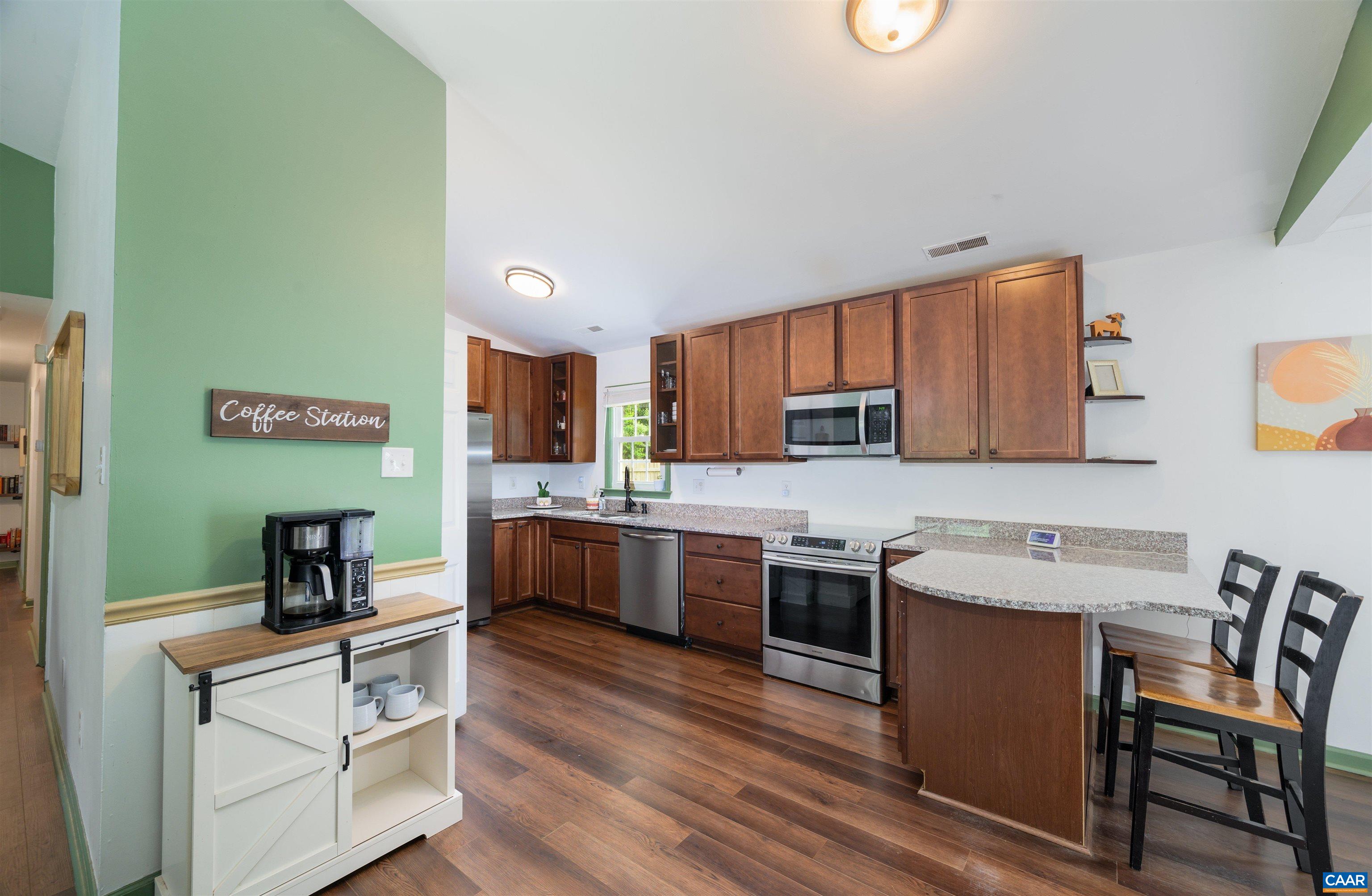 71 Blue Bell Road Ruckersville, VA 22968 - Photo 13 of 28 a kitchen with a sink cabinets and wooden floor