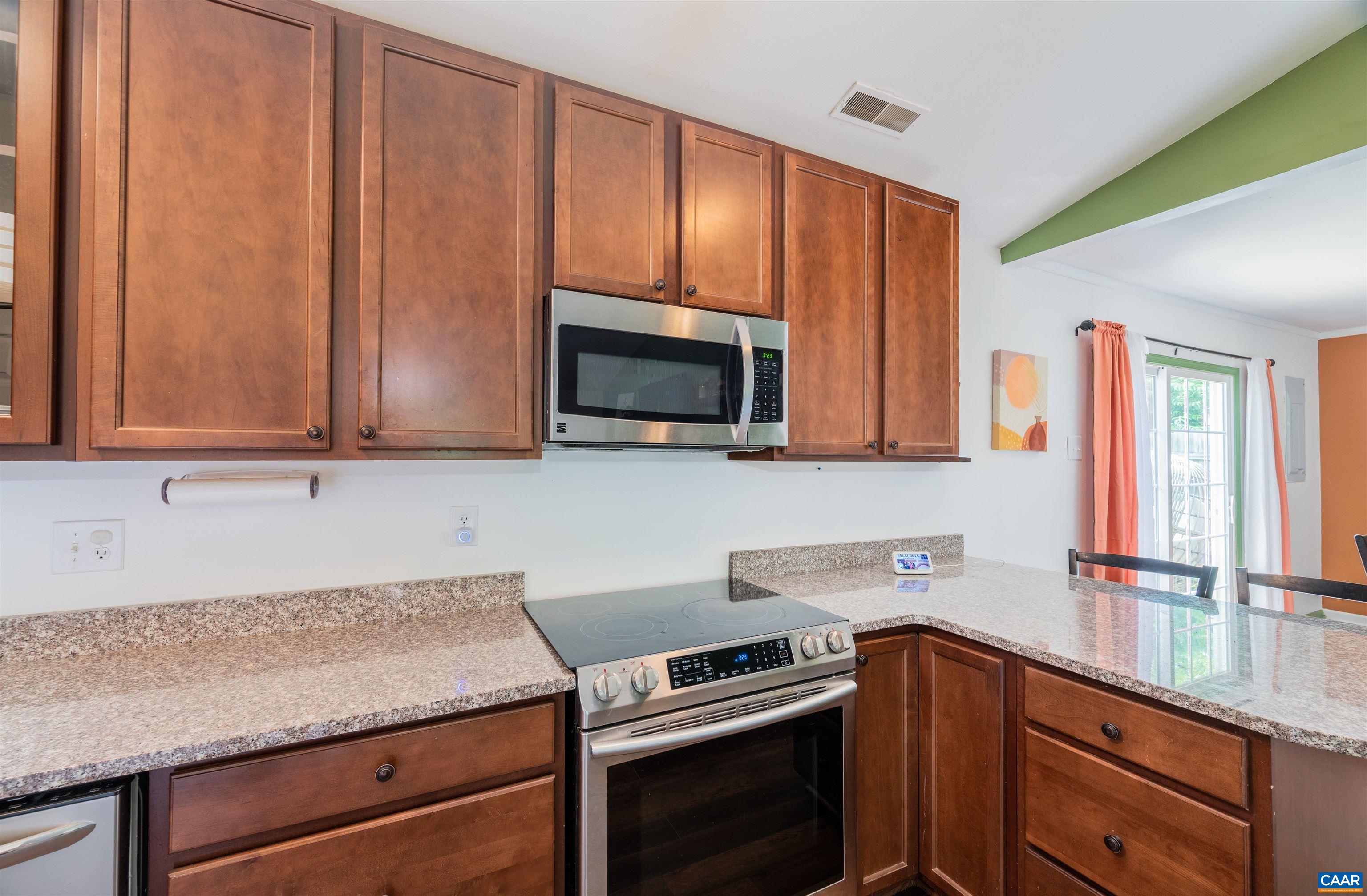 71 Blue Bell Road Ruckersville, VA 22968 - Photo 16 of 28 a kitchen with stainless steel appliances granite countertop wooden cabinets a stove a sink and dishwasher