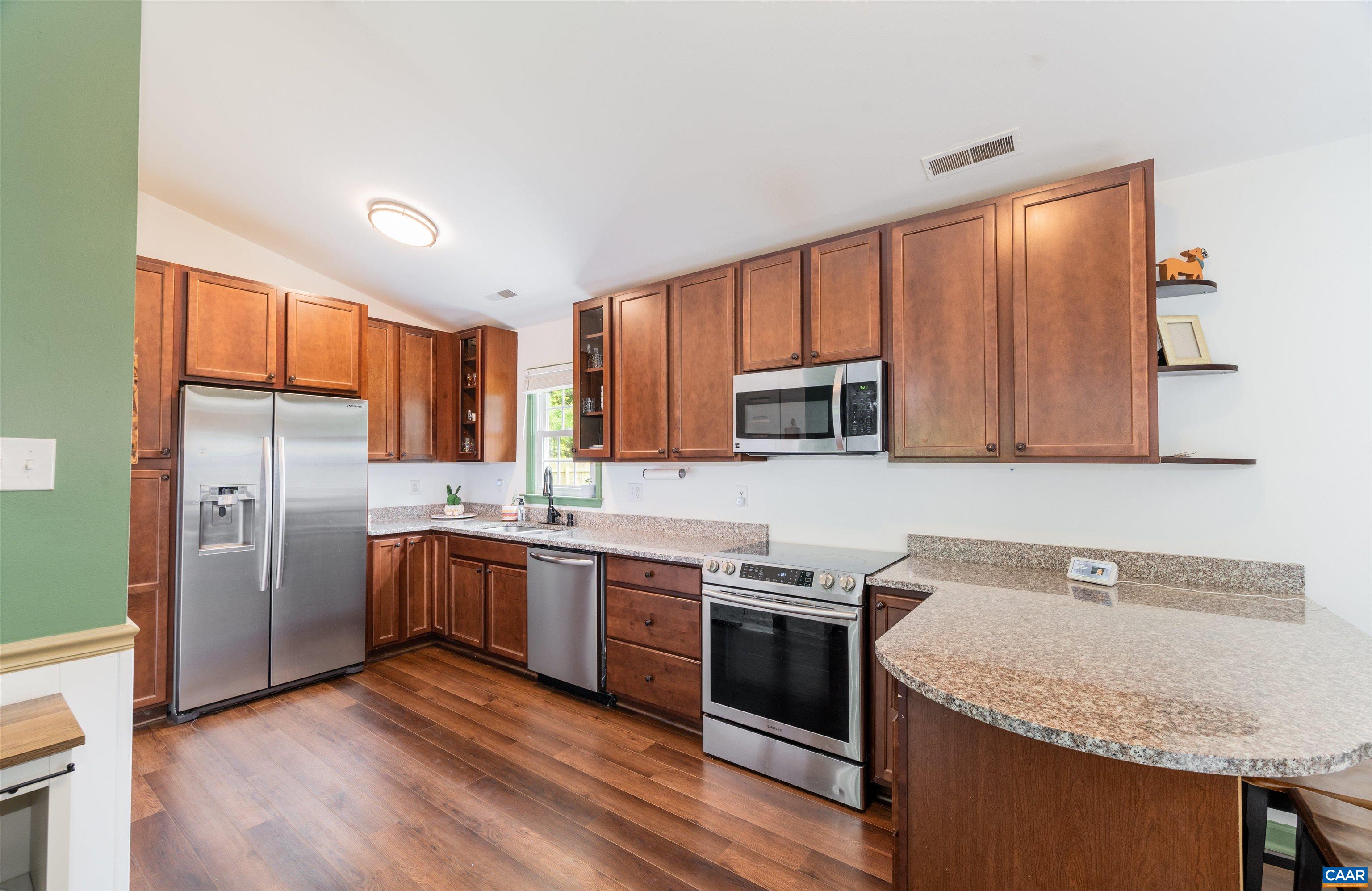 71 Blue Bell Road Ruckersville, VA 22968 - Photo 2 of 28 a kitchen with stainless steel appliances granite countertop a sink stove and refrigerator