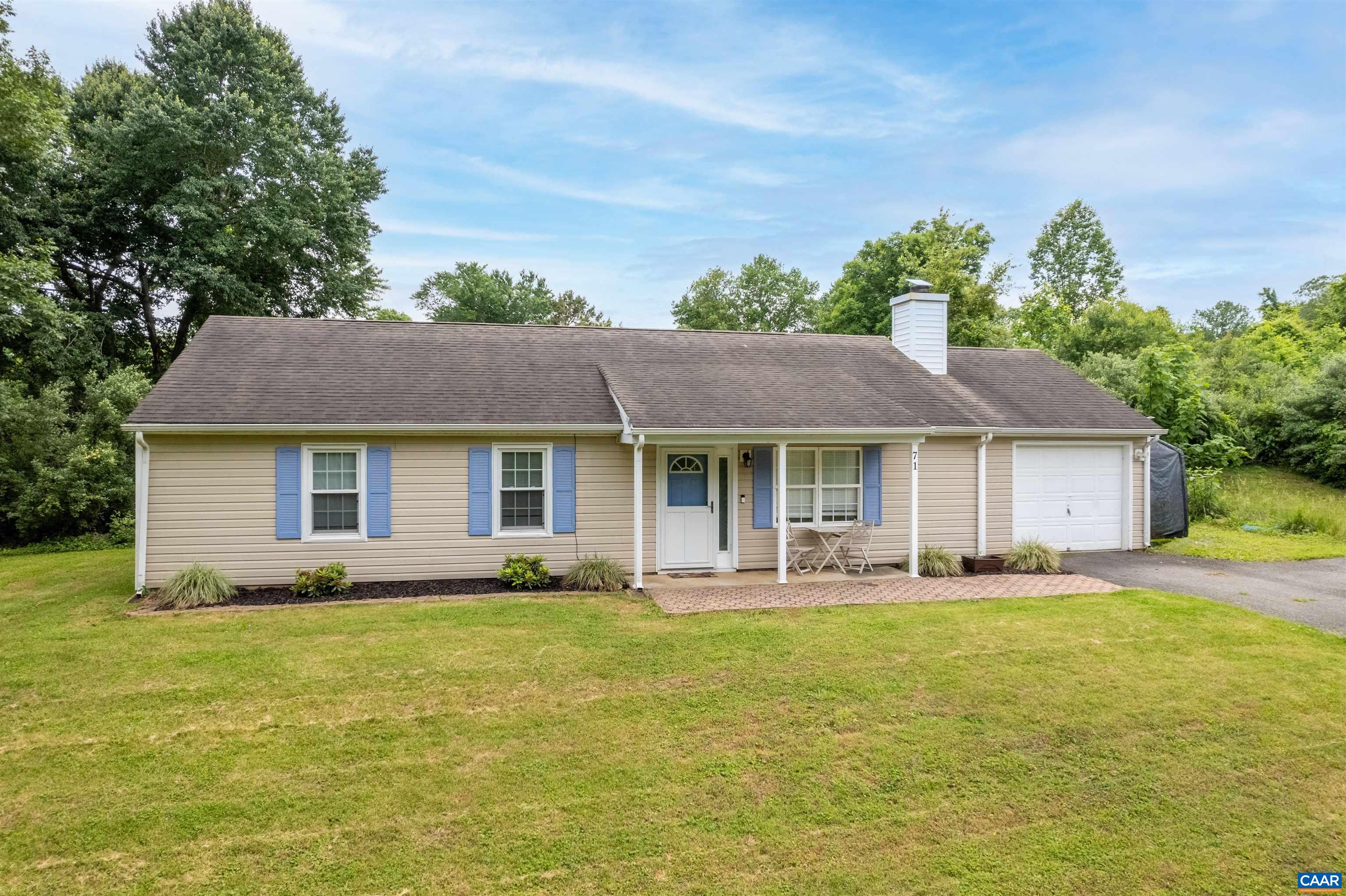 71 Blue Bell Road Ruckersville, VA 22968 - Photo 8 of 28 a front view of house with yard and trees in the background