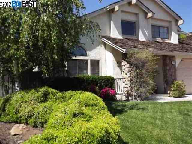 1655 Meadow Lark Lane Tracy, CA 95376 - Photo 1 of 1 a front view of a house with a yard