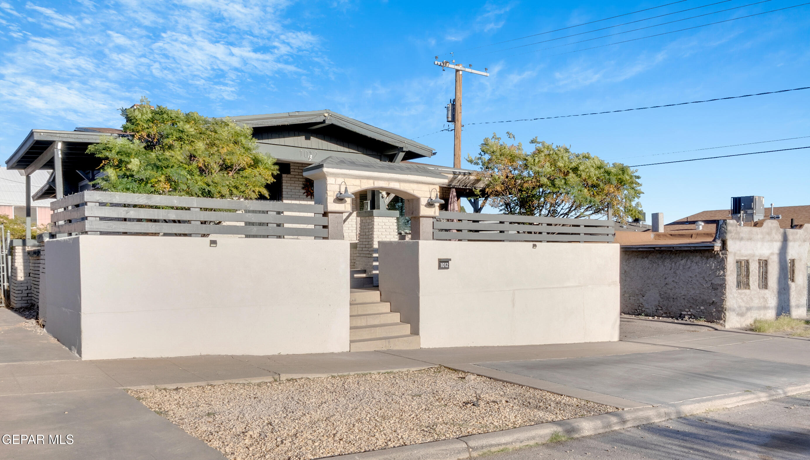 1012 Maple Street El Paso, TX 79903 - Photo 1 of 1 a view of a house with a backyard and windows