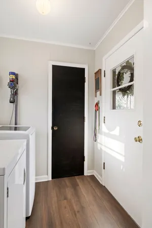 a view of empty room with windows and cabinet