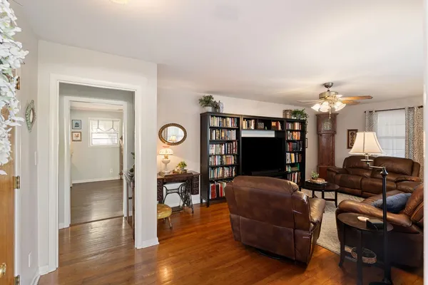 a view of a livingroom with furniture and wooden floor