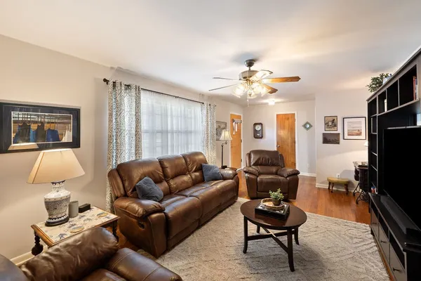 a living room with furniture fireplace and a flat screen tv