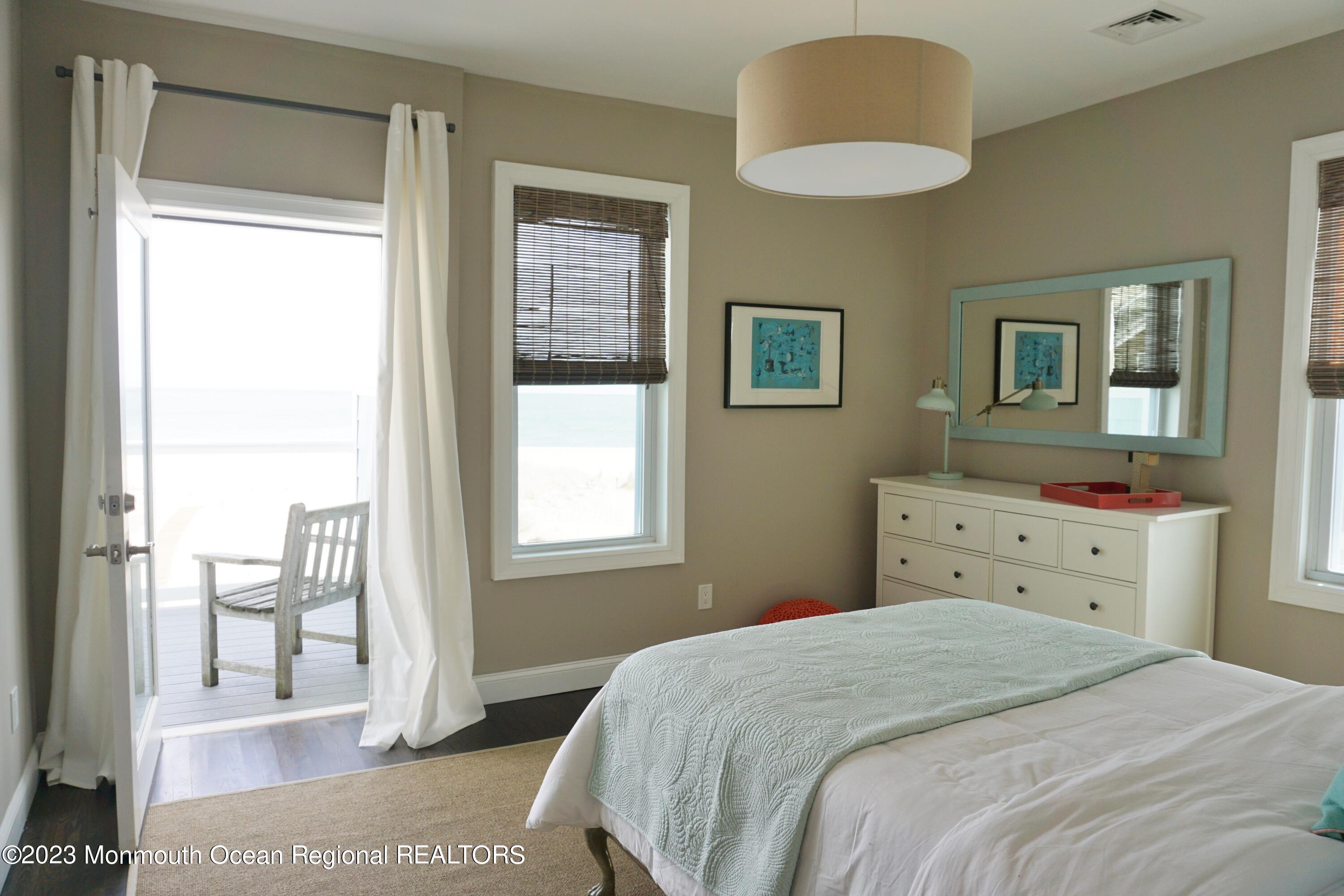 469 Ocean Avenue North, Unit WINTER Long Branch, NJ 07740 - Photo 20 of 47 a bedroom with a bed and a window