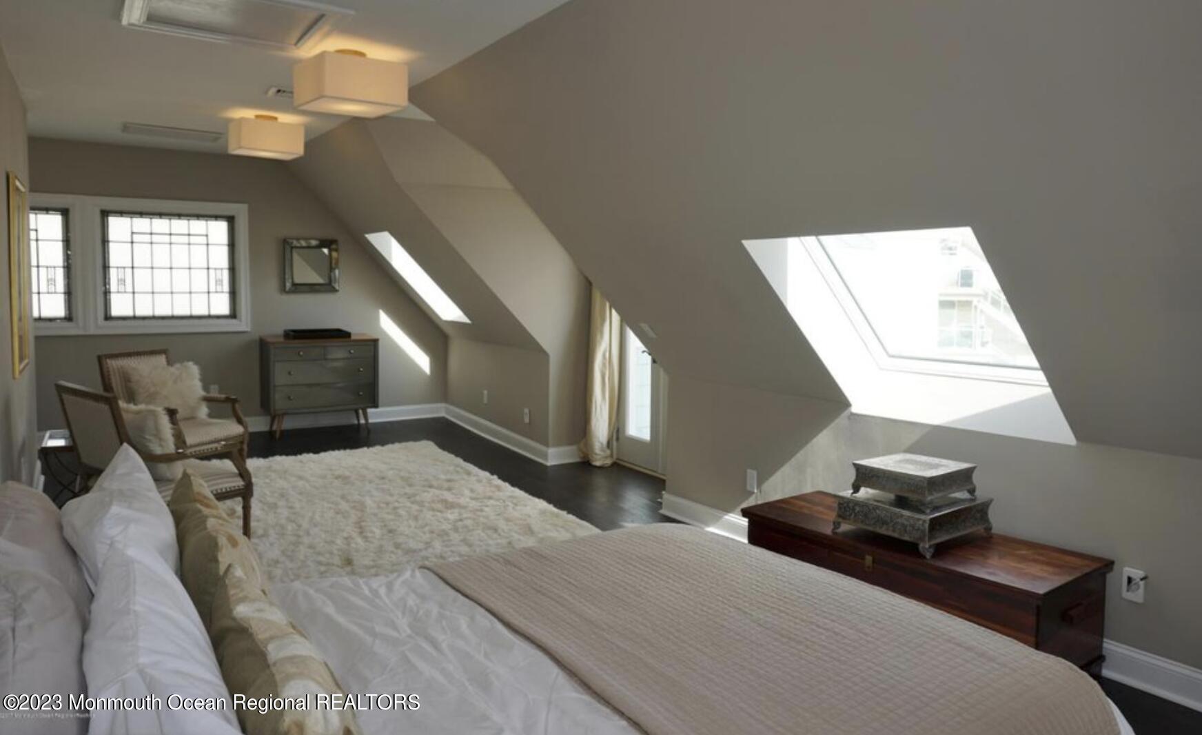 469 Ocean Avenue North, Unit WINTER Long Branch, NJ 07740 - Photo 26 of 47 a bedroom with a bed and window