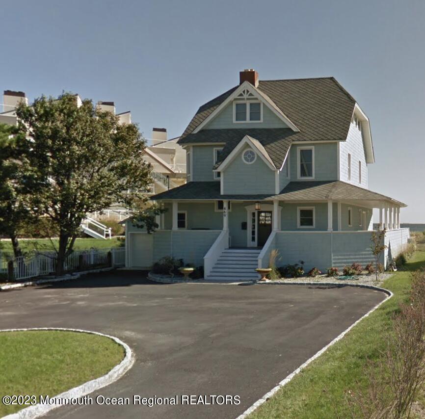 469 Ocean Avenue North, Unit WINTER Long Branch, NJ 07740 - Photo 40 of 47 a front view of a house with a yard