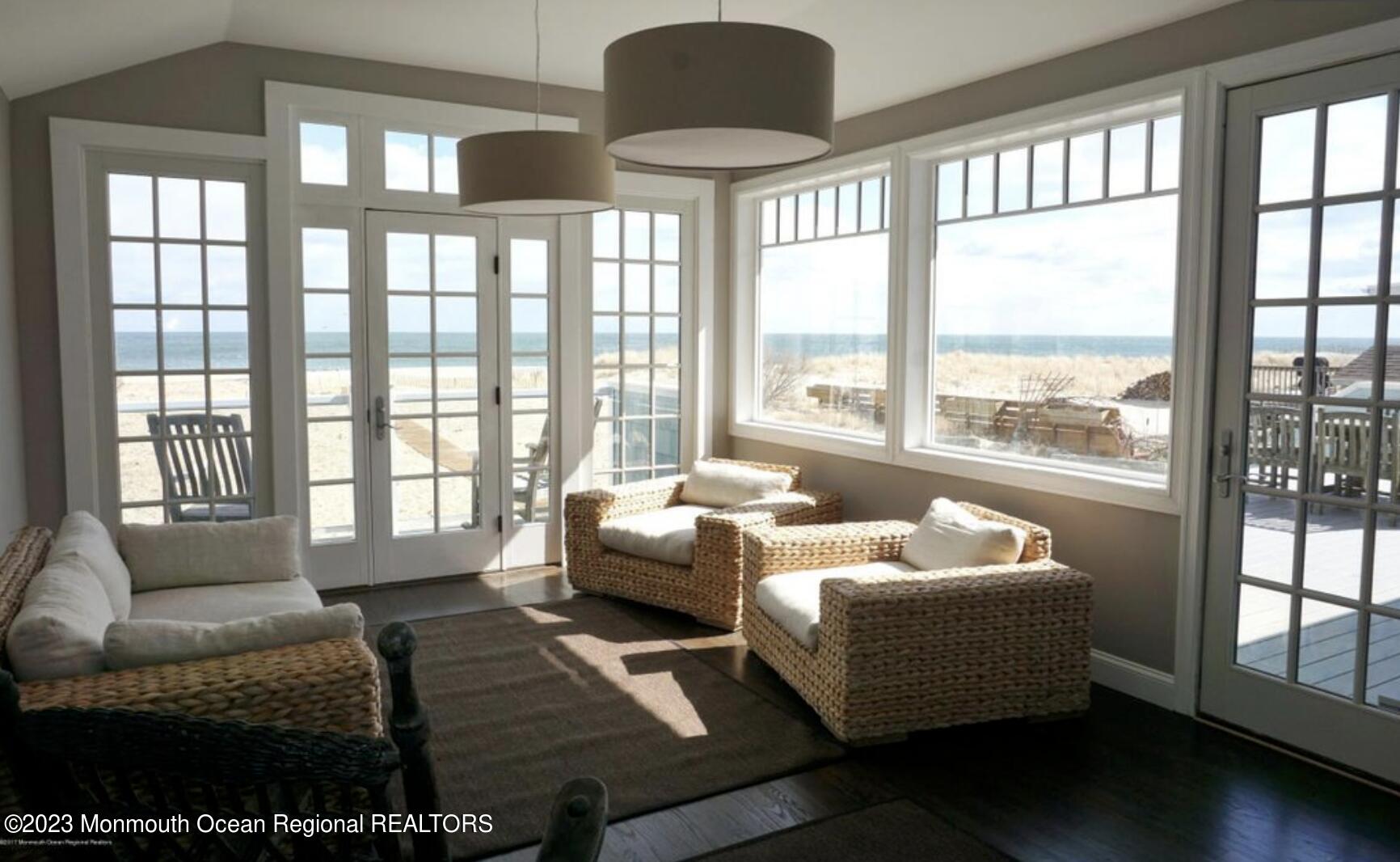 469 Ocean Avenue North, Unit WINTER Long Branch, NJ 07740 - Photo 5 of 47 a living room with furniture and floor to ceiling windows