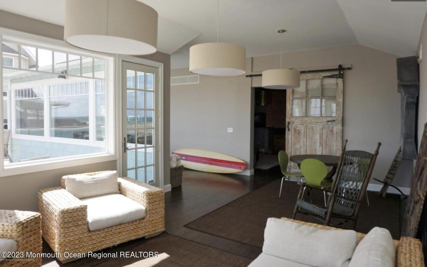469 Ocean Avenue North, Unit WINTER Long Branch, NJ 07740 - Photo 7 of 47 a living room with furniture and a window