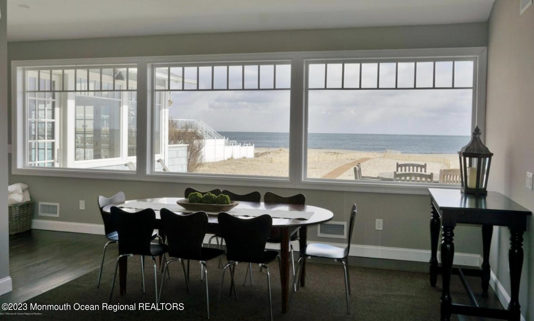 469 Ocean Avenue North, Unit WINTER Long Branch, NJ 07740 - Photo 10 of 47 a view of a dining room with furniture and window