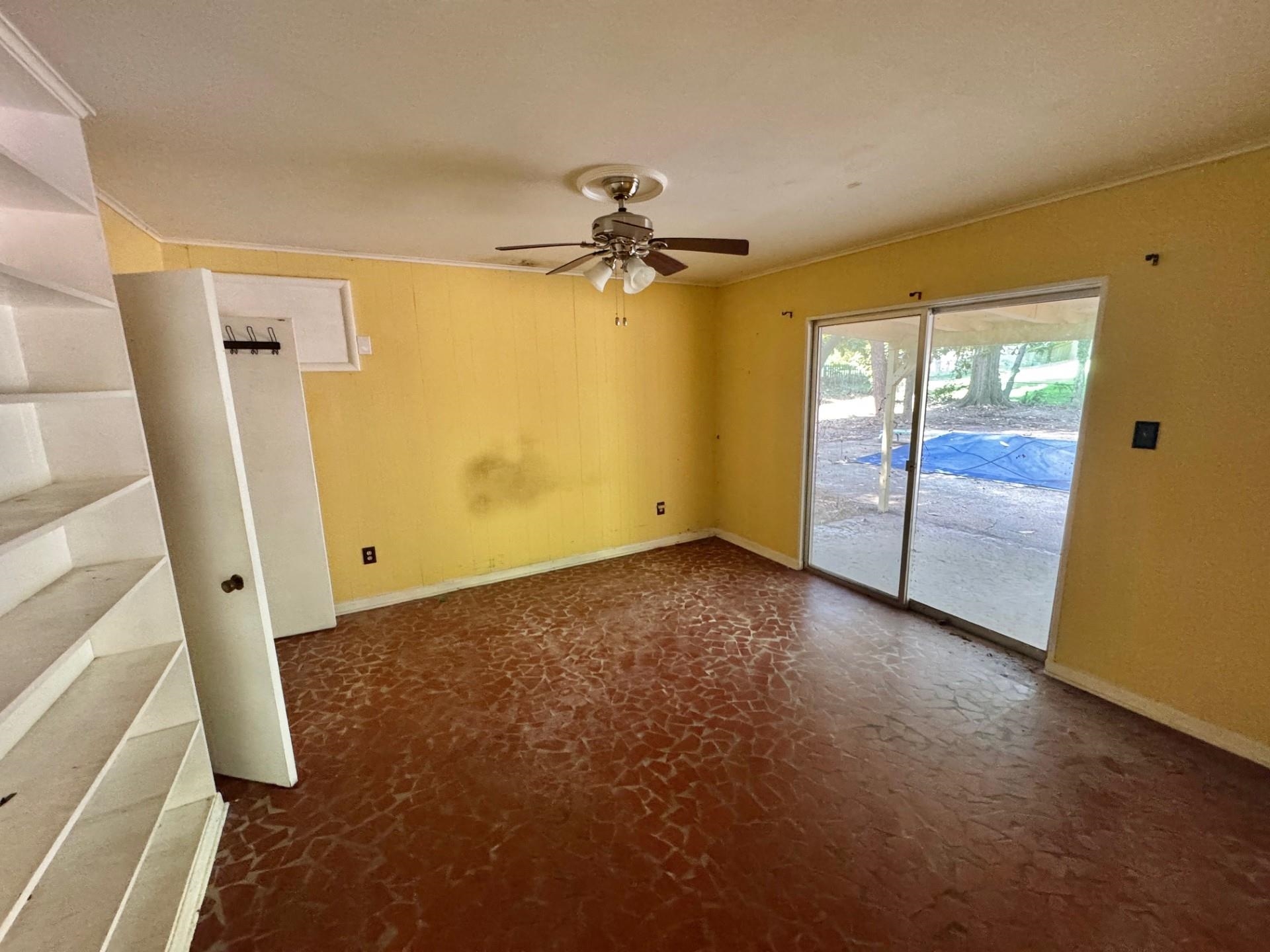 5429 Normandy Road Memphis, TN 38120 - Photo 5 of 25 Spare room with baseboards and a ceiling fan