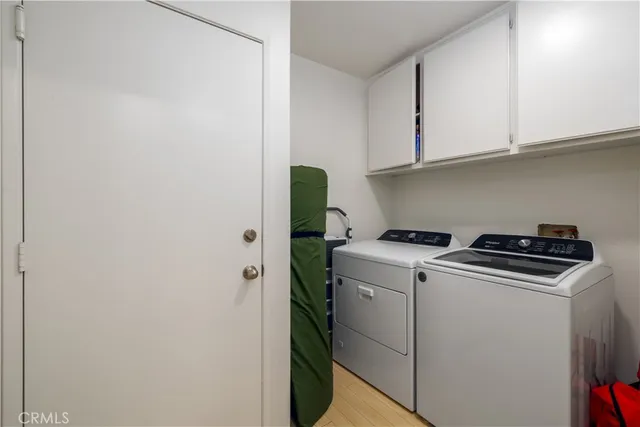 a view of a chair and table on the patio