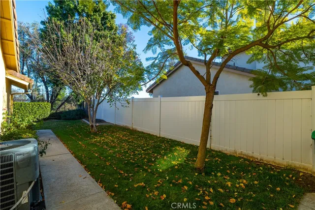 a view of swimming pool with a patio and a yard