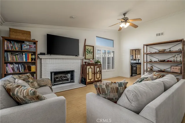 a living room with furniture fireplace and a flat screen tv