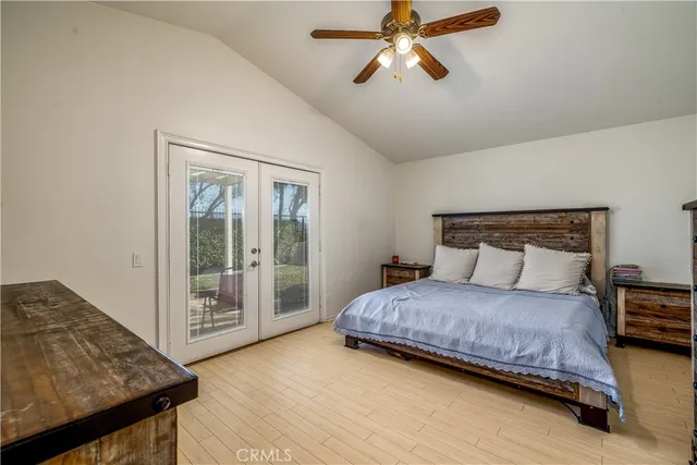 a bedroom with a bed and a night stand