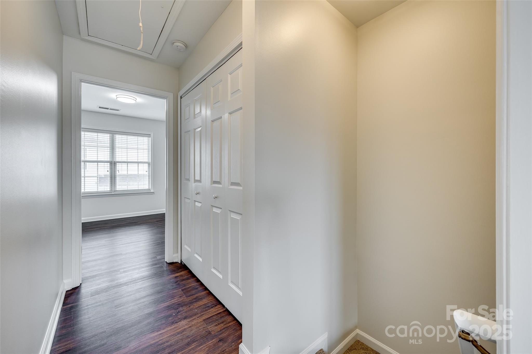2035 Lennox Square Road Charlotte, NC 28210 - Photo 14 of 29 a view of a hallway with wooden floor and closet