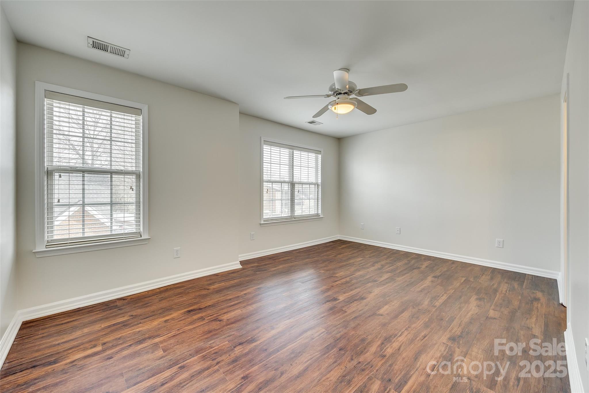 2035 Lennox Square Road Charlotte, NC 28210 - Photo 15 of 29 wooden floor in an empty room with a window
