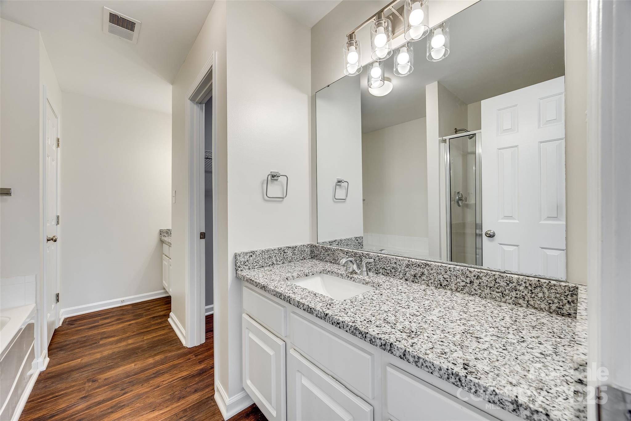 2035 Lennox Square Road Charlotte, NC 28210 - Photo 18 of 29 a bathroom with a sink and a mirror