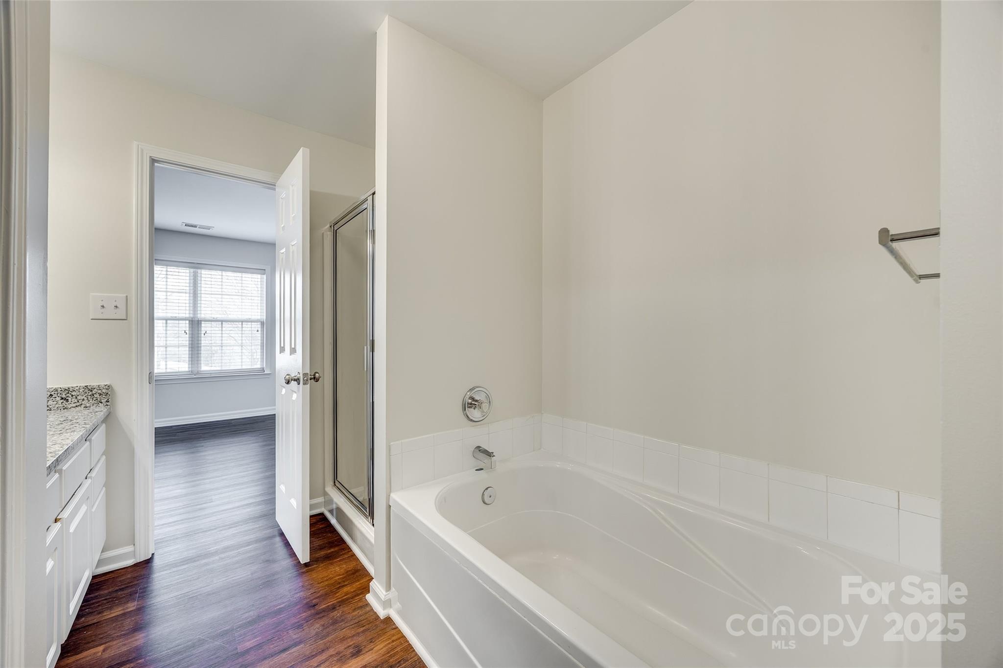 2035 Lennox Square Road Charlotte, NC 28210 - Photo 20 of 29 a bathroom with a bathtub and a shower