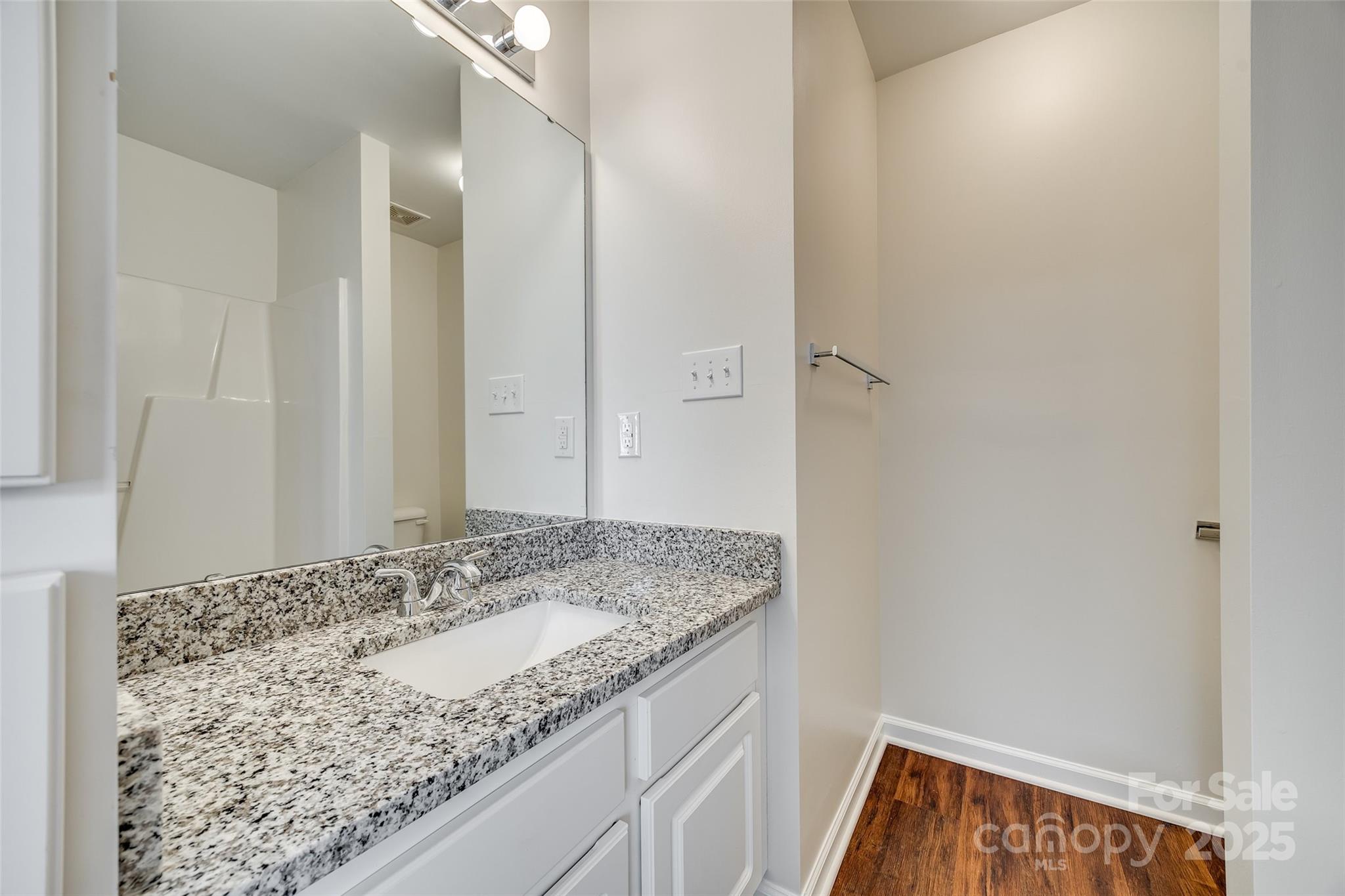 2035 Lennox Square Road Charlotte, NC 28210 - Photo 24 of 29 a bathroom with a granite countertop sink and a mirror
