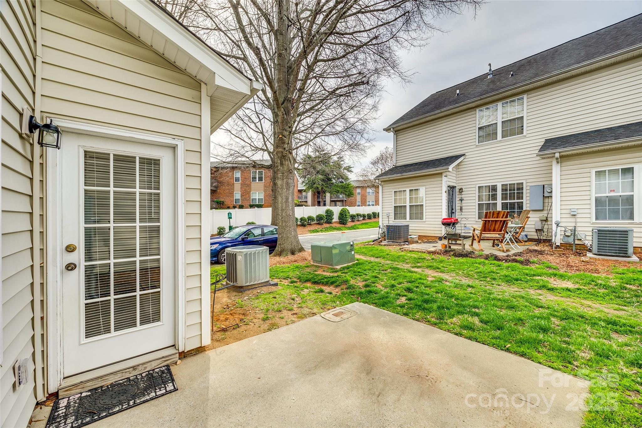 2035 Lennox Square Road Charlotte, NC 28210 - Photo 26 of 29 a front view of a house with a yard patio and fire pit