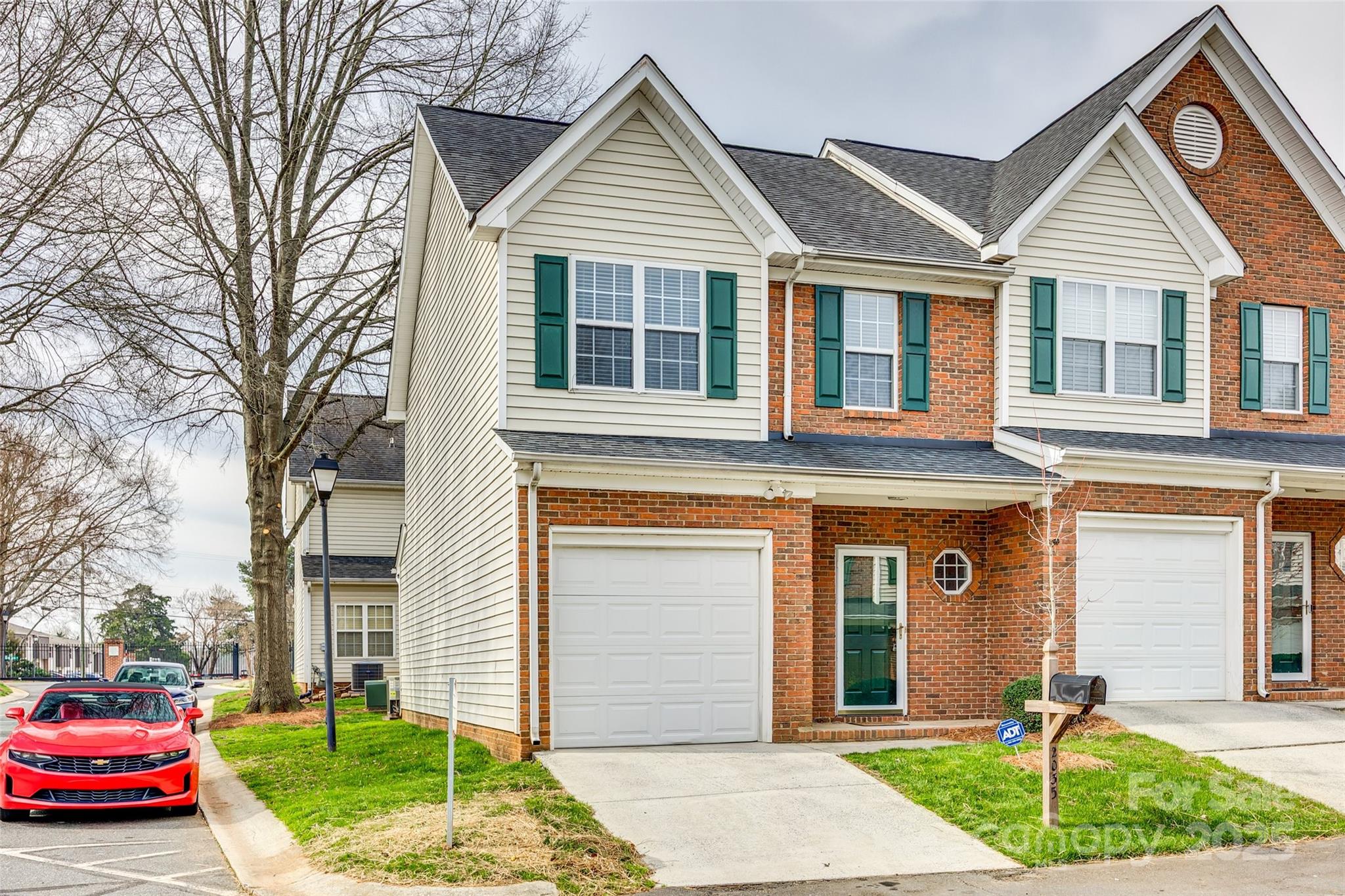 2035 Lennox Square Road Charlotte, NC 28210 - Photo 29 of 29 a front view of a house with a yard and garage