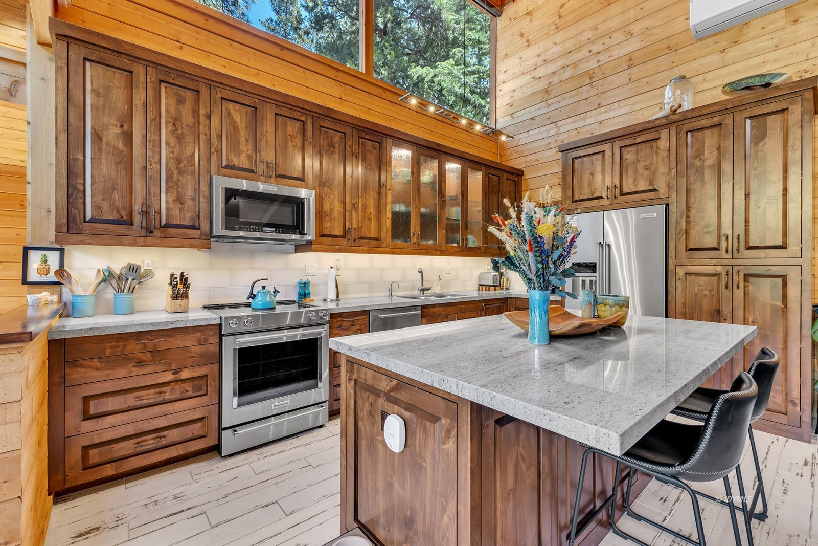 24924 Fern Valley Road Idyllwild, CA 92549 - Photo 28 of 72 a kitchen with stainless steel appliances granite countertop a stove refrigerator sink and cabinets