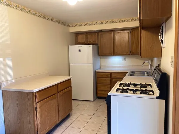a kitchen with a cabinets and a stove
