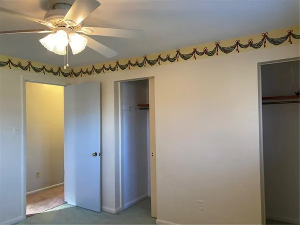 a view of a chandelier in hallway with a chandelier