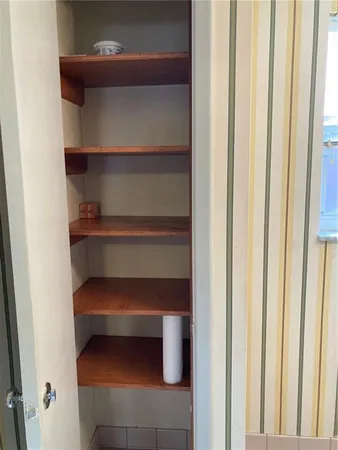 a close view of cabinet with two chair