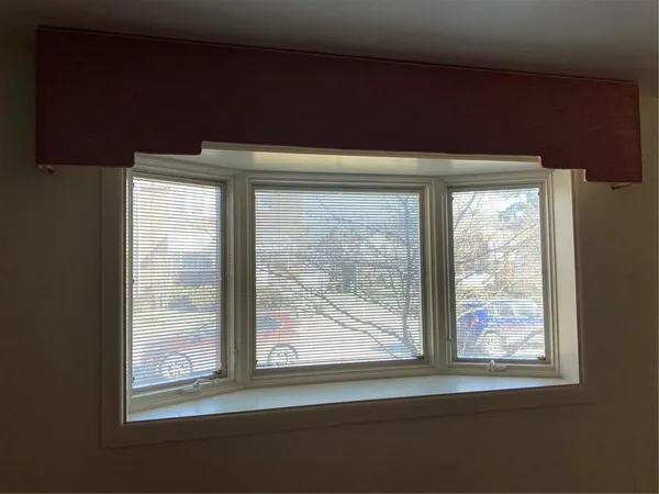 a view of a room that has a window in it