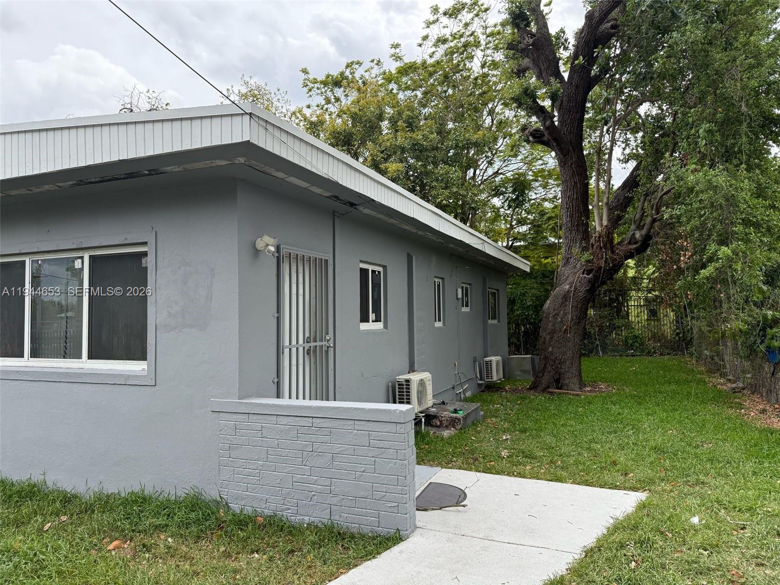 170 Northeast 68th Terrace Miami, FL 33138 - Photo 3 of 8 a view of house with a yard