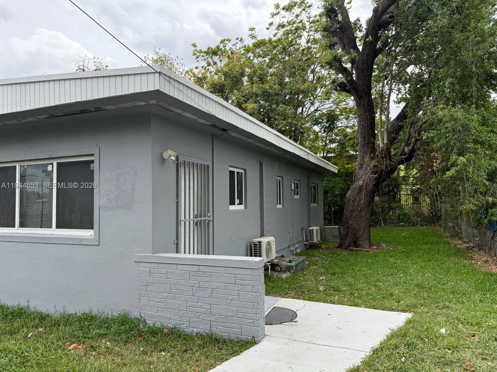 170 Northeast 68th Terrace Miami, FL 33138 - Photo 6 of 8 a view of house with a yard