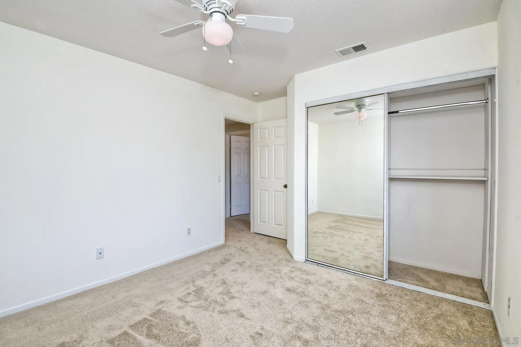 13921 Midland Road Poway, CA 92064 - Photo 14 of 25 an empty room with closet and a chandelier fan