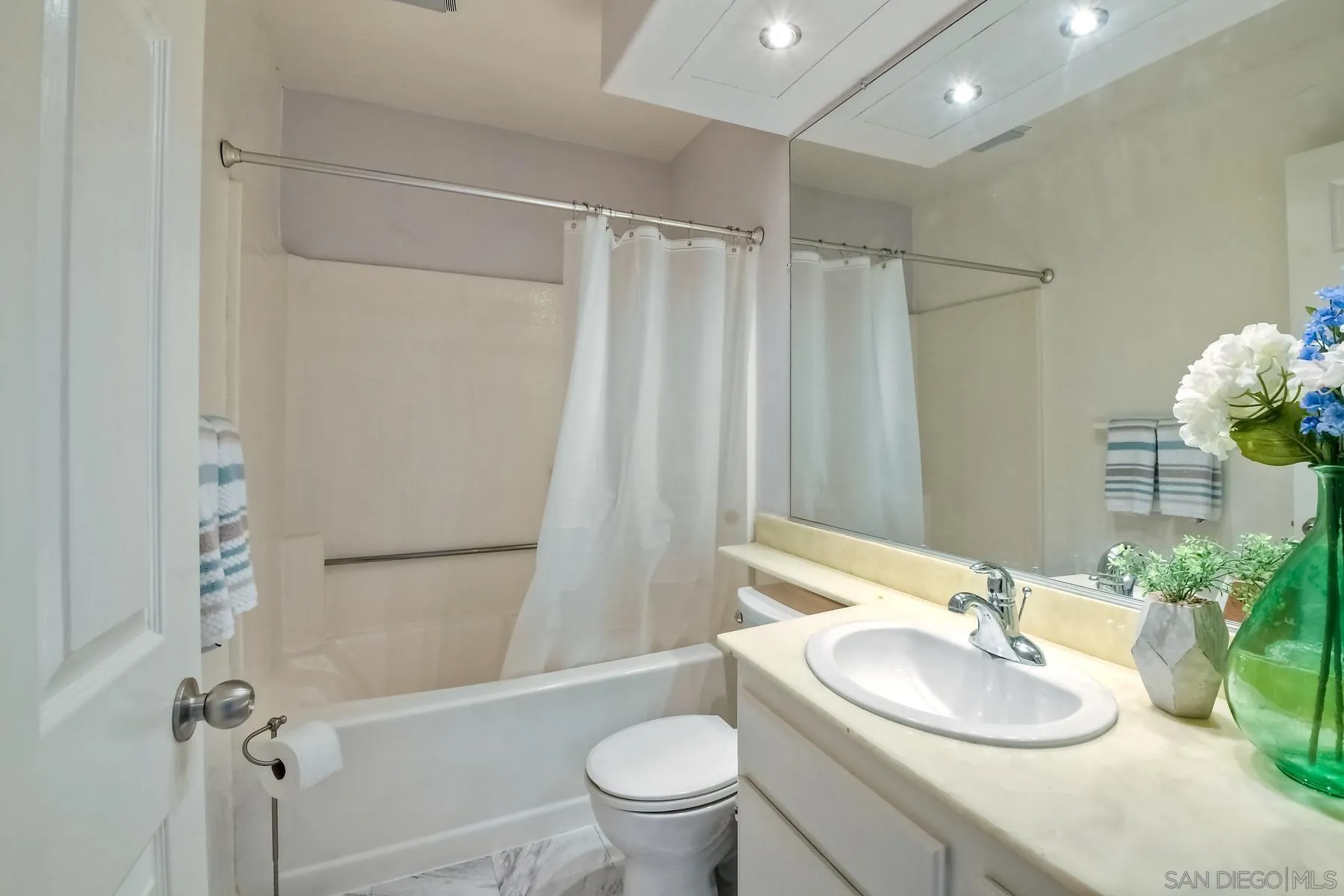 13921 Midland Road Poway, CA 92064 - Photo 16 of 25 a bathroom with a granite countertop sink toilet and shower