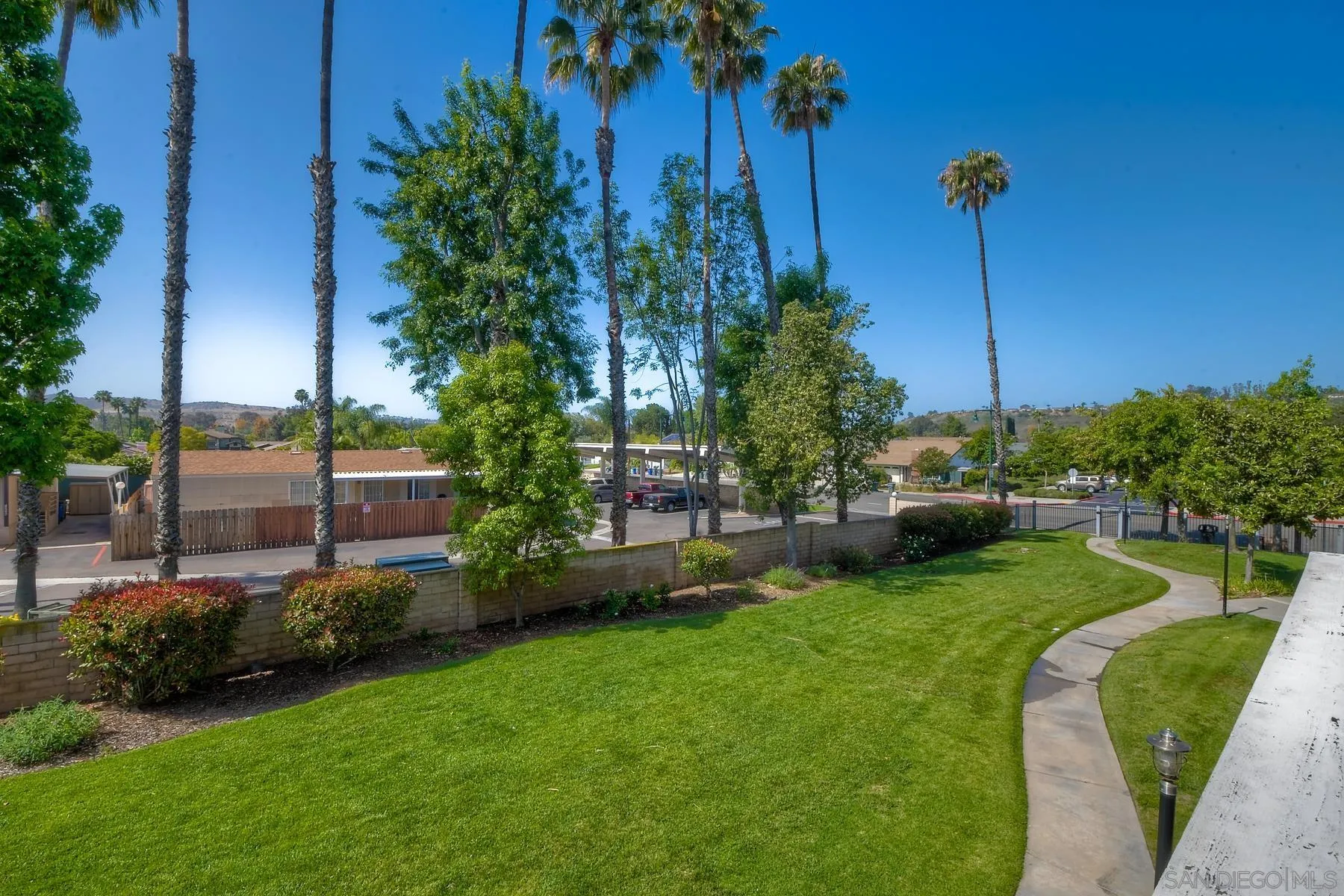 13921 Midland Road Poway, CA 92064 - Photo 19 of 25 a view of a garden with a building in the background