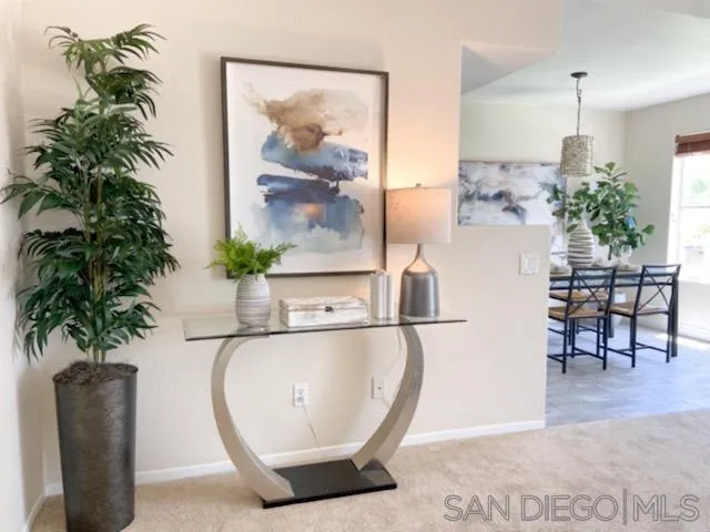 13921 Midland Road Poway, CA 92064 - Photo 2 of 25 a view of a dining room with furniture and a potted plant