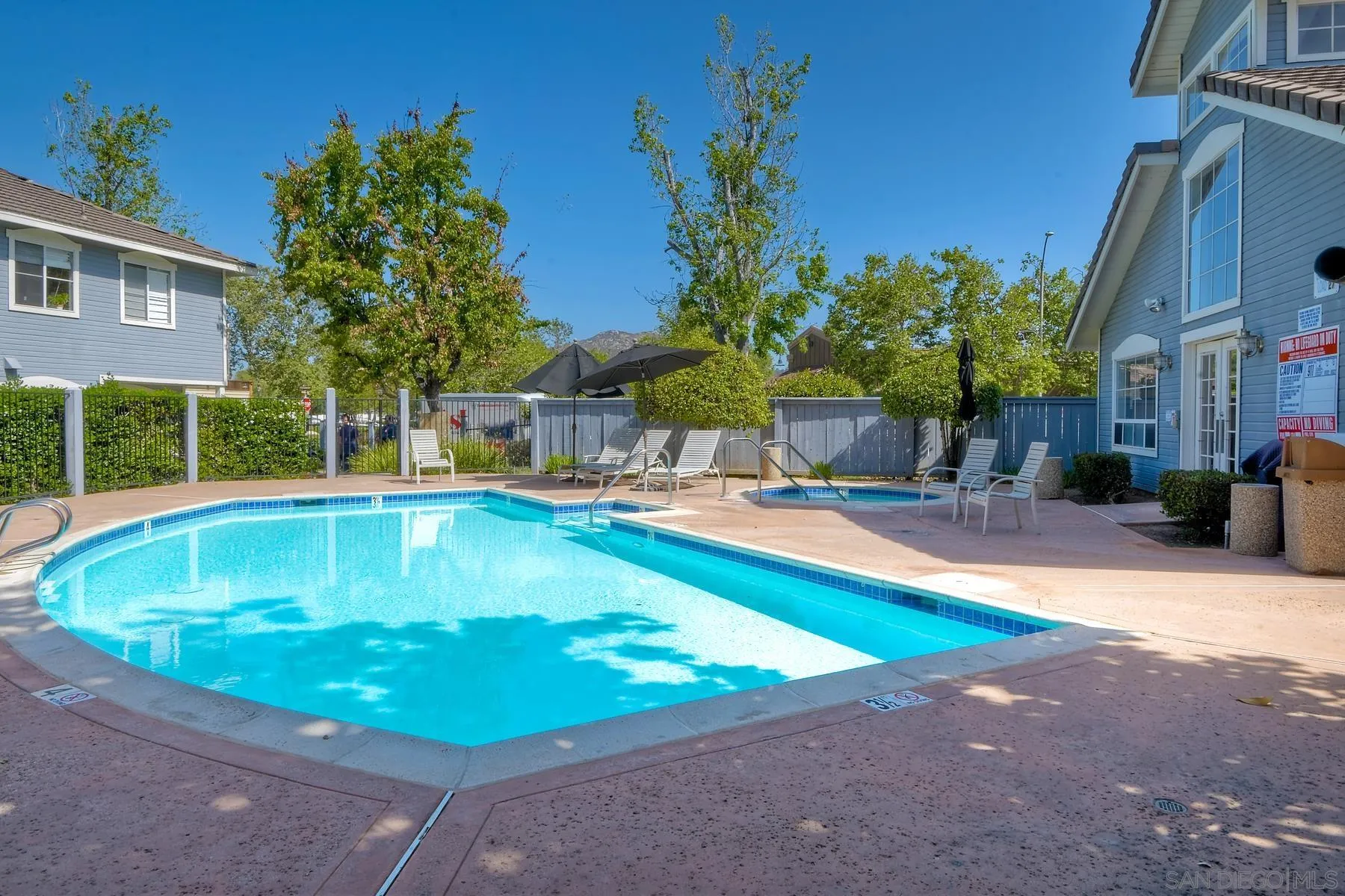 13921 Midland Road Poway, CA 92064 - Photo 23 of 25 a view of a swimming pool with a patio