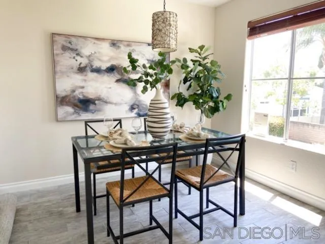13921 Midland Road Poway, CA 92064 - Photo 6 of 25 a view of a dining room with furniture window and wooden floor