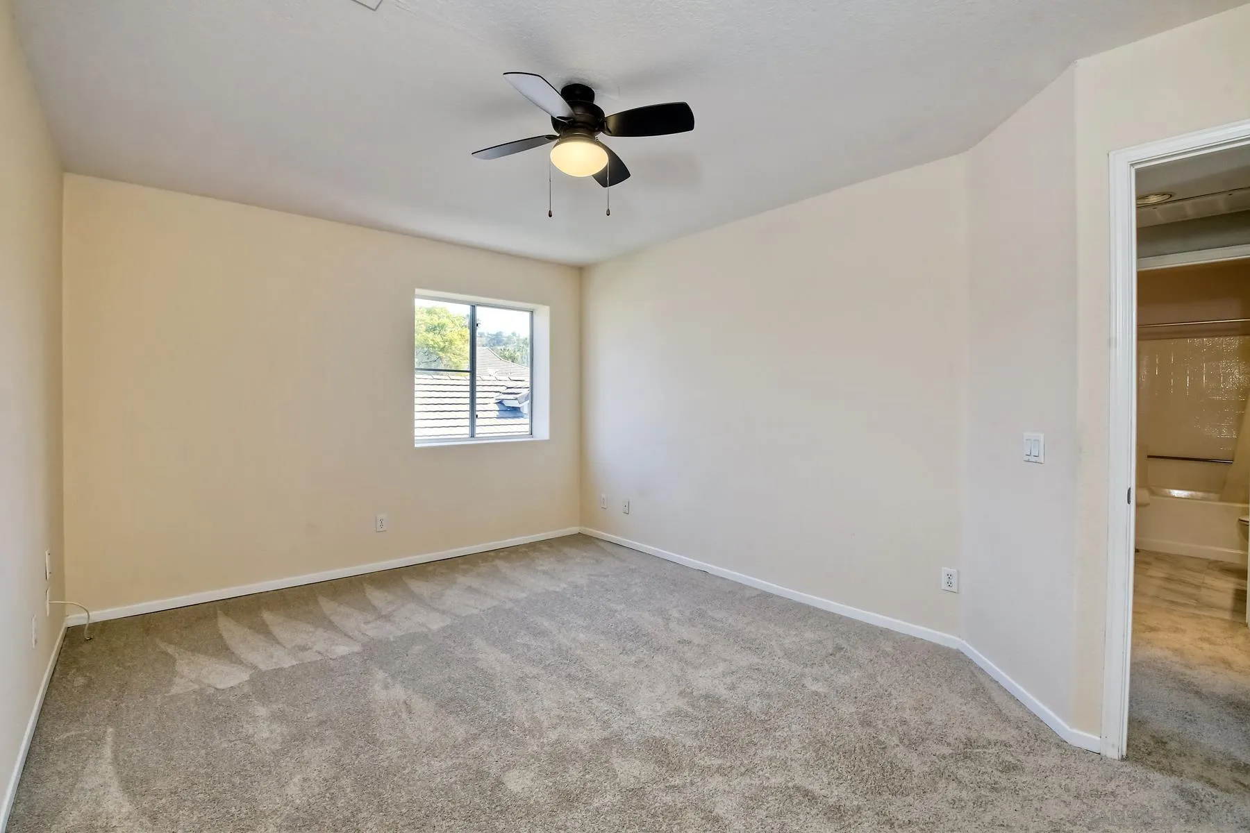 13921 Midland Road Poway, CA 92064 - Photo 9 of 25 an empty room with windows and fan